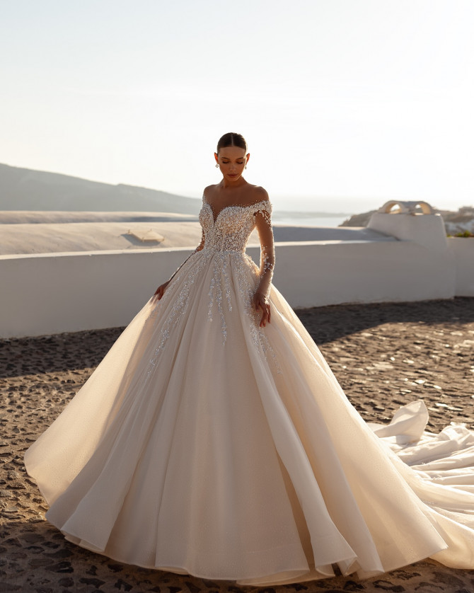 Mermaid wedding dress with structured bodice and dramatic flare. Timeless Bridal Gowns with lace details