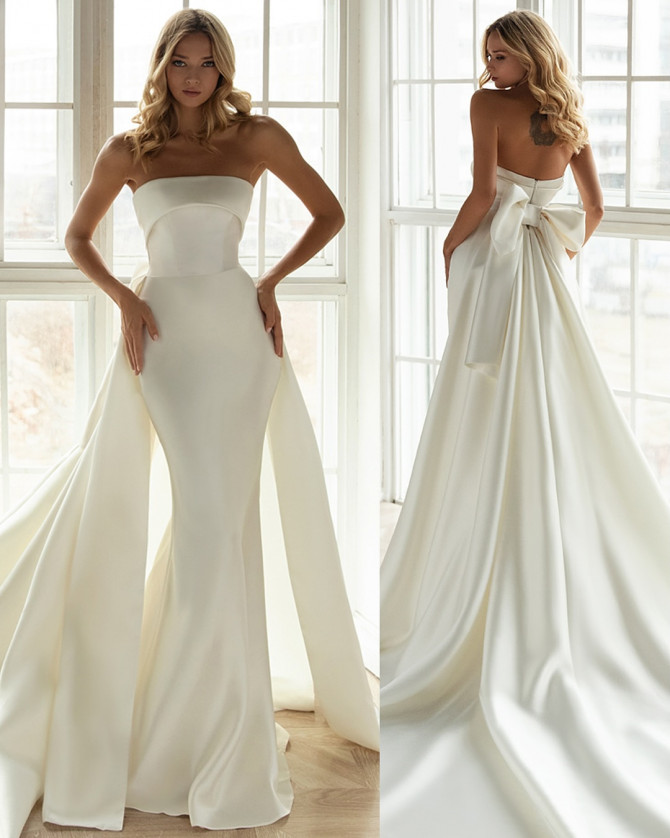 Bridal gown with illusion neckline and embroidered lace detailing. Timeless Bridal Gowns with lace details