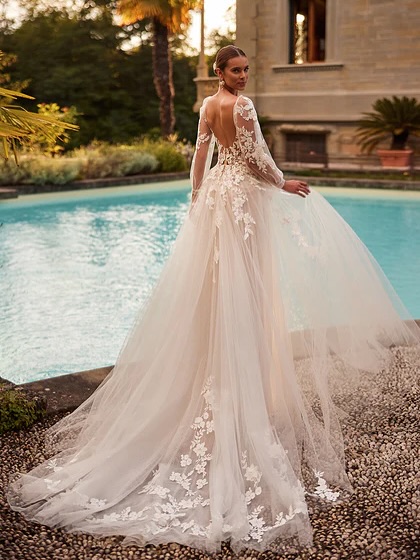 : Satin ballgown with structured bodice and voluminous skirt. Elegant wedding gown from France