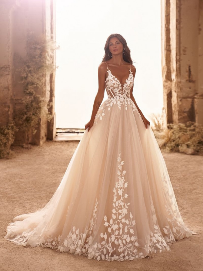Grand cathedral wedding gown with full train and lace details. Elegant wedding gown from France