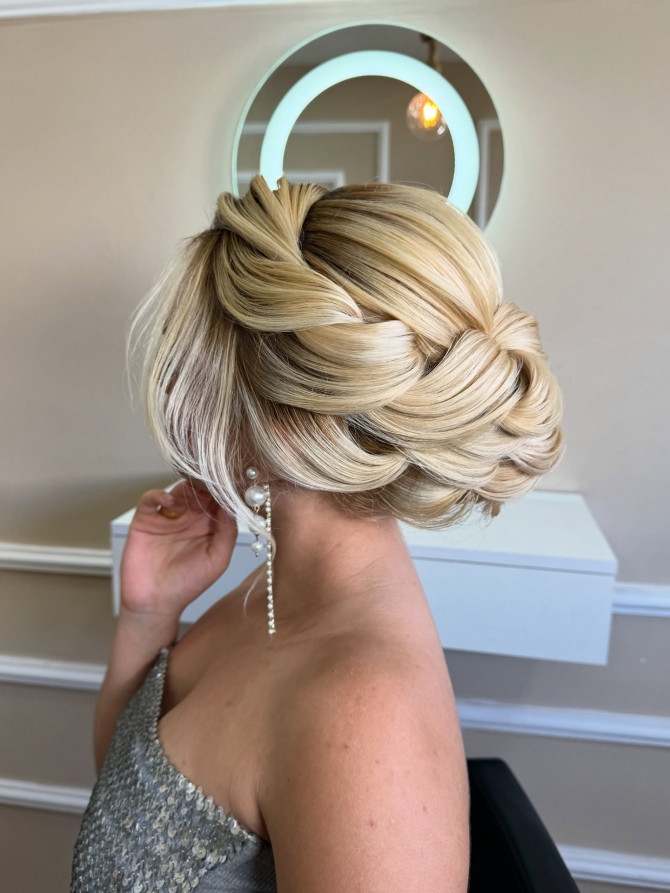 Voluminous wovth interlaced bun.