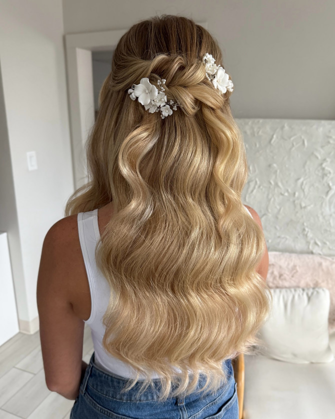 Bridal Hollywood waves with white flower clips and half-up style 
