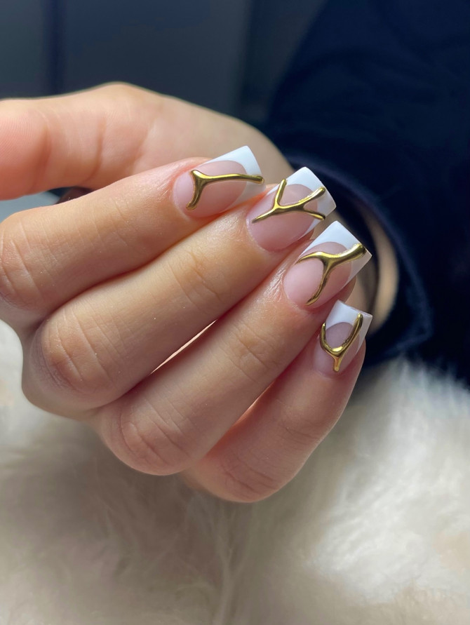 white French bridal nails with sculptural gold 3D accents