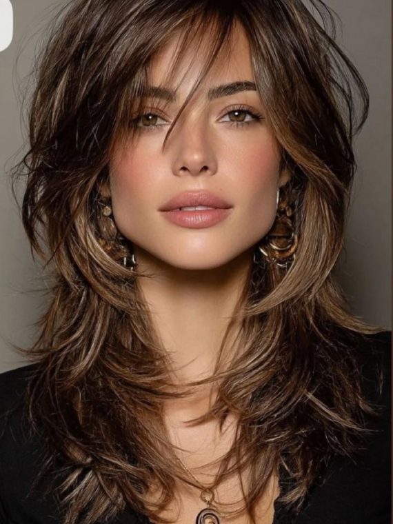 Feathered layered haircut with tousled curtain bangs