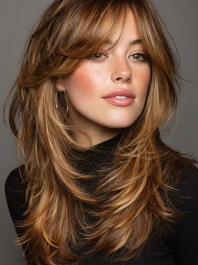 Golden layered haircut with curtain bangs