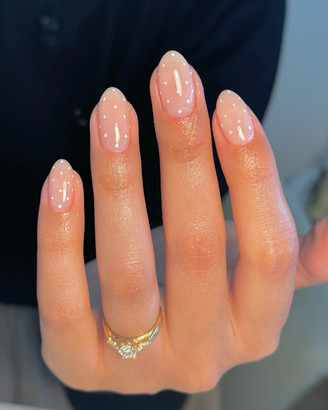 nude bridal nails with tiny white polka dots