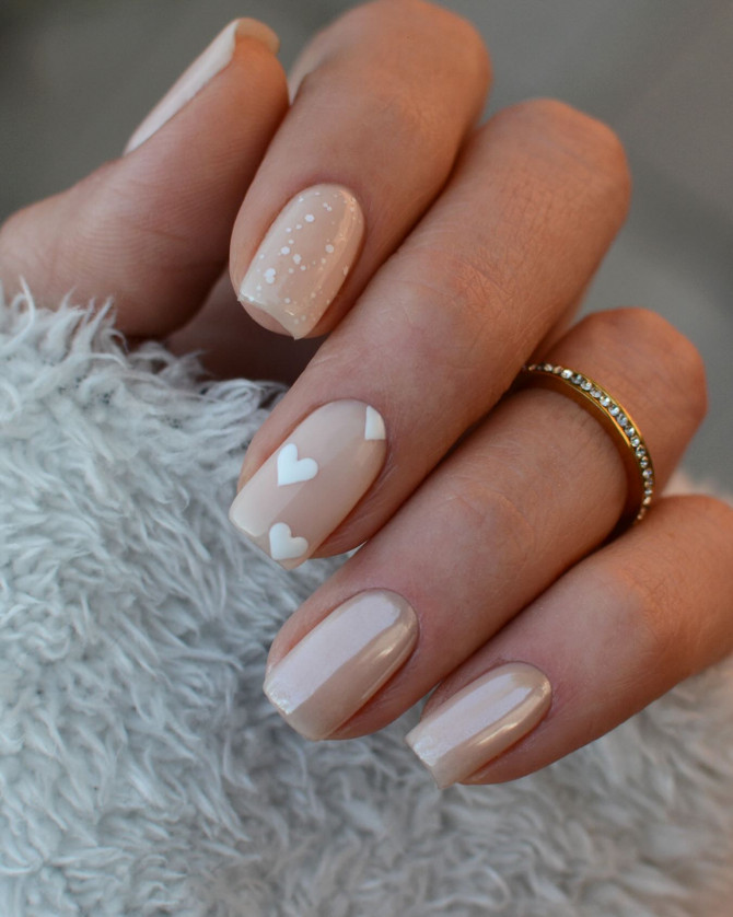 nude wedding nails with floating white hearts