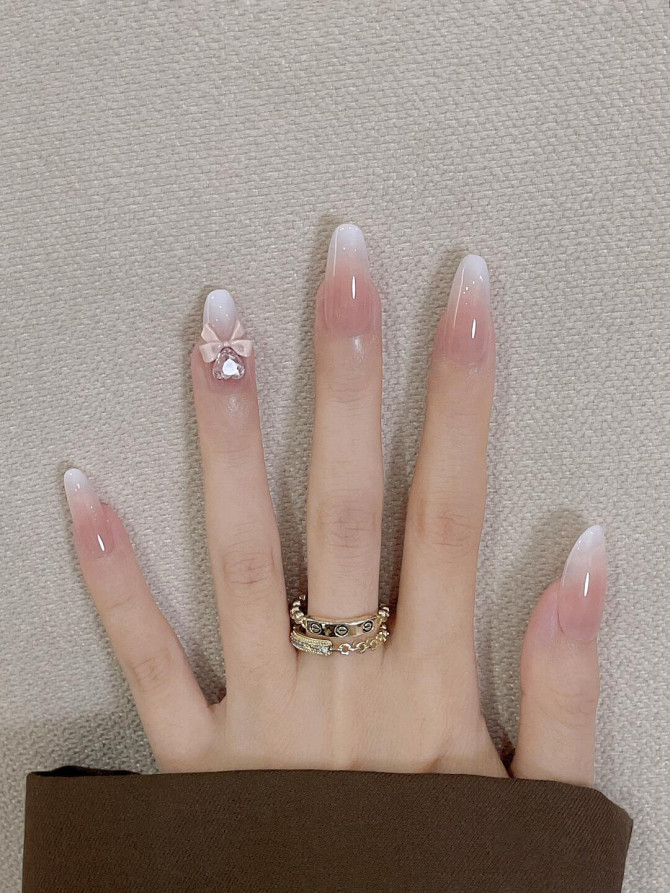 oft pink ombré bridal nails with 3D bow charm