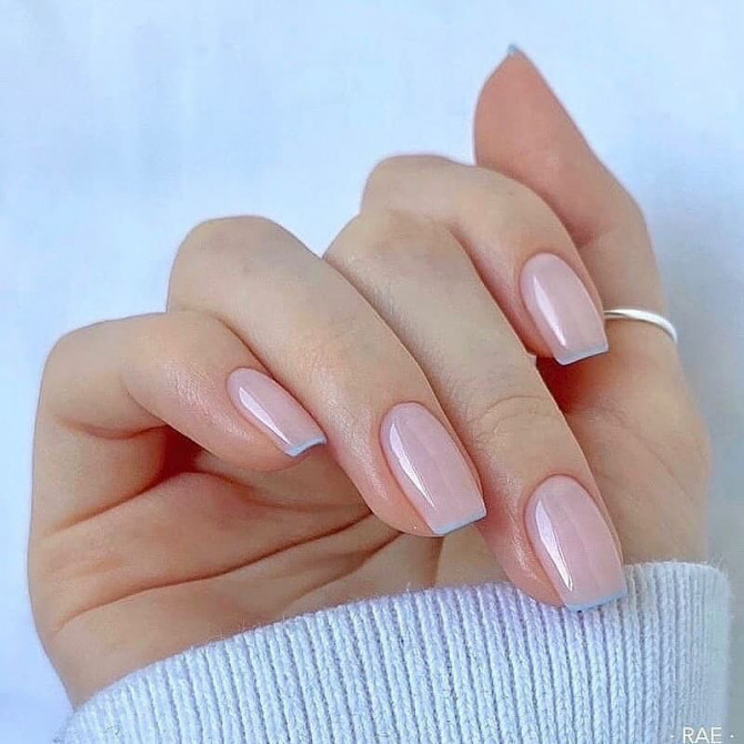 Minimal nude French nails with soft blue tips