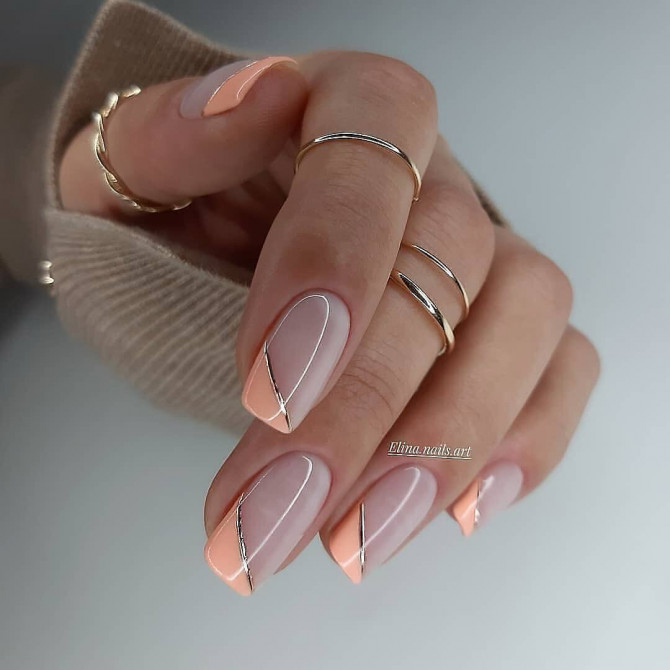 Nude acrylic nails with peach diagonal tips