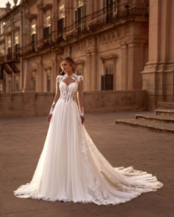 Illusion lace corset A-line wedding dress with long sleeves and chapel train — international bridal gowns inspiration.