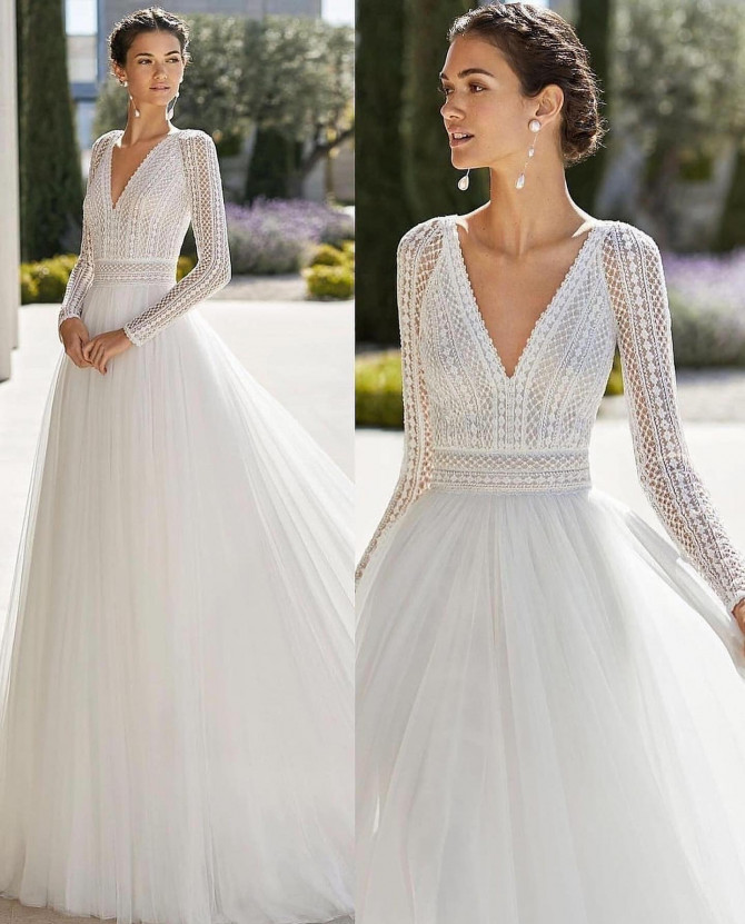 Long sleeve crochet lace bodice with airy tulle A-line skirt — international bridal gowns romantic.