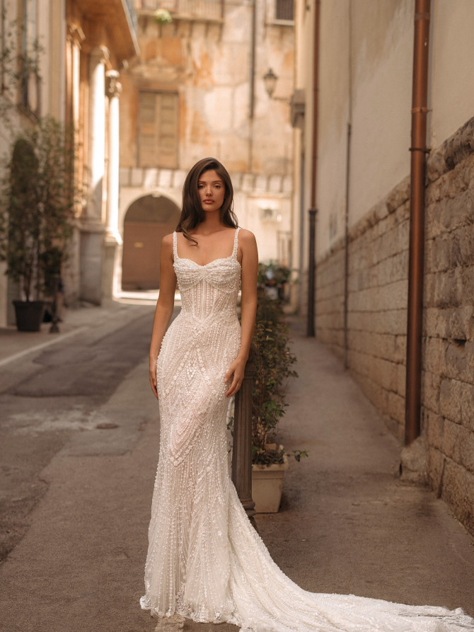 Art-deco beaded sheath with corset bodice and chapel train — international bridal gowns inspiration.