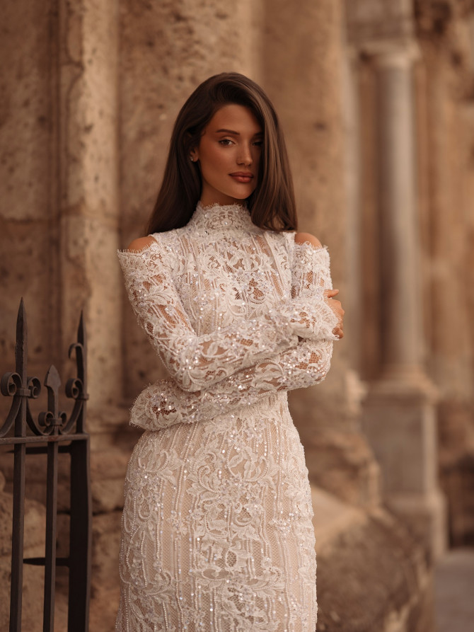 High-neck cutout lace long-sleeve column — international bridal gowns detail.