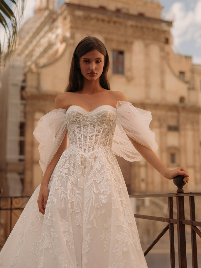  Off-shoulder ballgown with airy tulle sleeves and floral appliqué — international bridal gowns fairytale.