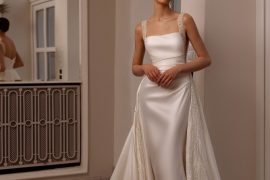 Satin square-neck sheath with beaded straps and overskirt — international bridal gowns look.