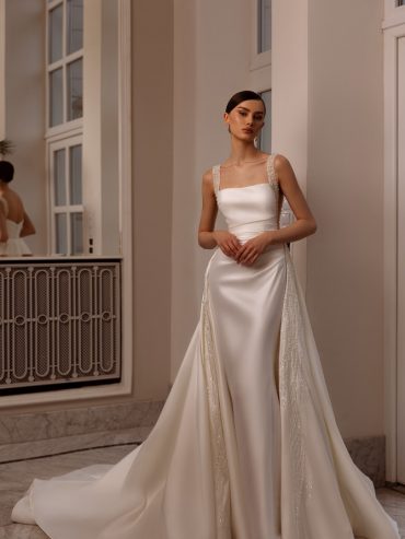 Satin square-neck sheath with beaded straps and overskirt — international bridal gowns look.