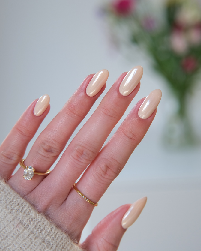Nude beige almond nails with glossy finish, minimalist manicure for chic everyday style