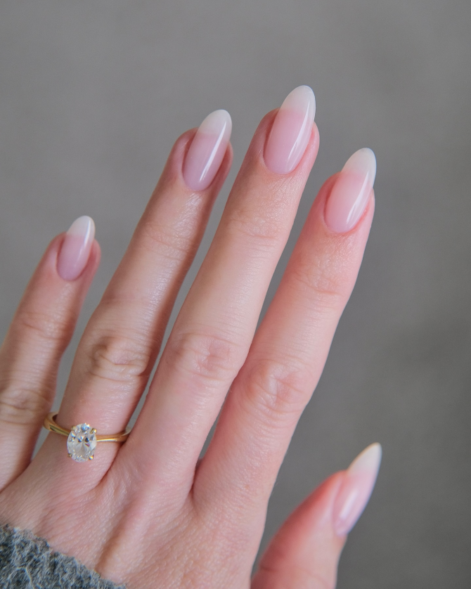 oft pink almond nails with ombré pink-to-white gradient and glossy finish for weddings