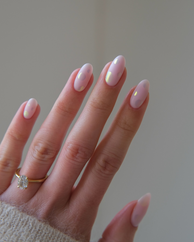 Pastel pink polka dot manicure with iridescent accents