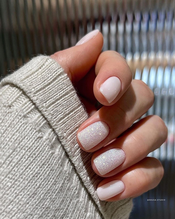 White short acrylic nails with subtle glitter shimmer Minimalist Blue Nails with Pearl Bow Tips