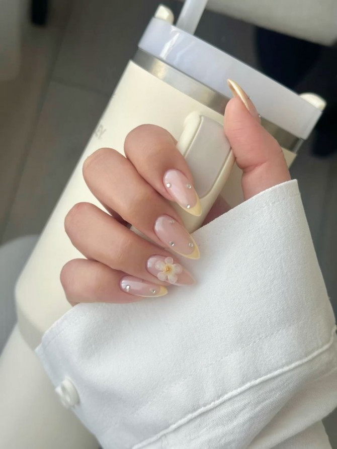 bridal nails with pastel yellow French tips and 3D daisy